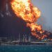 Fire is seen over fuel storage tanks that exploded near Cuba's supertanker port in Matanzas, Cuba, August 8, 2022. REUTERS/Alexandre Meneghini