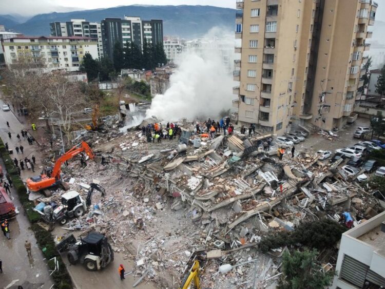 OSMANIYE, TURKIYE - FEBRUARY 06: An aerial view of debris as rescue workers conduct search and rescue operations on a collapsed building after the 7.4 magnitude earthquake hits Osmaniye, Turkiye on February 06, 2023. (Photo by Muzaffer Cagliyaner/Anadolu Agency via Getty Images)