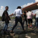 A group of migrants crosses the Rio Grande from Ciudad Juárez, Mexico into the United States, on Sept. 12, 2022. Most migrants are from Venezuela and turn to the Border Patrol in El Paso, Texas.